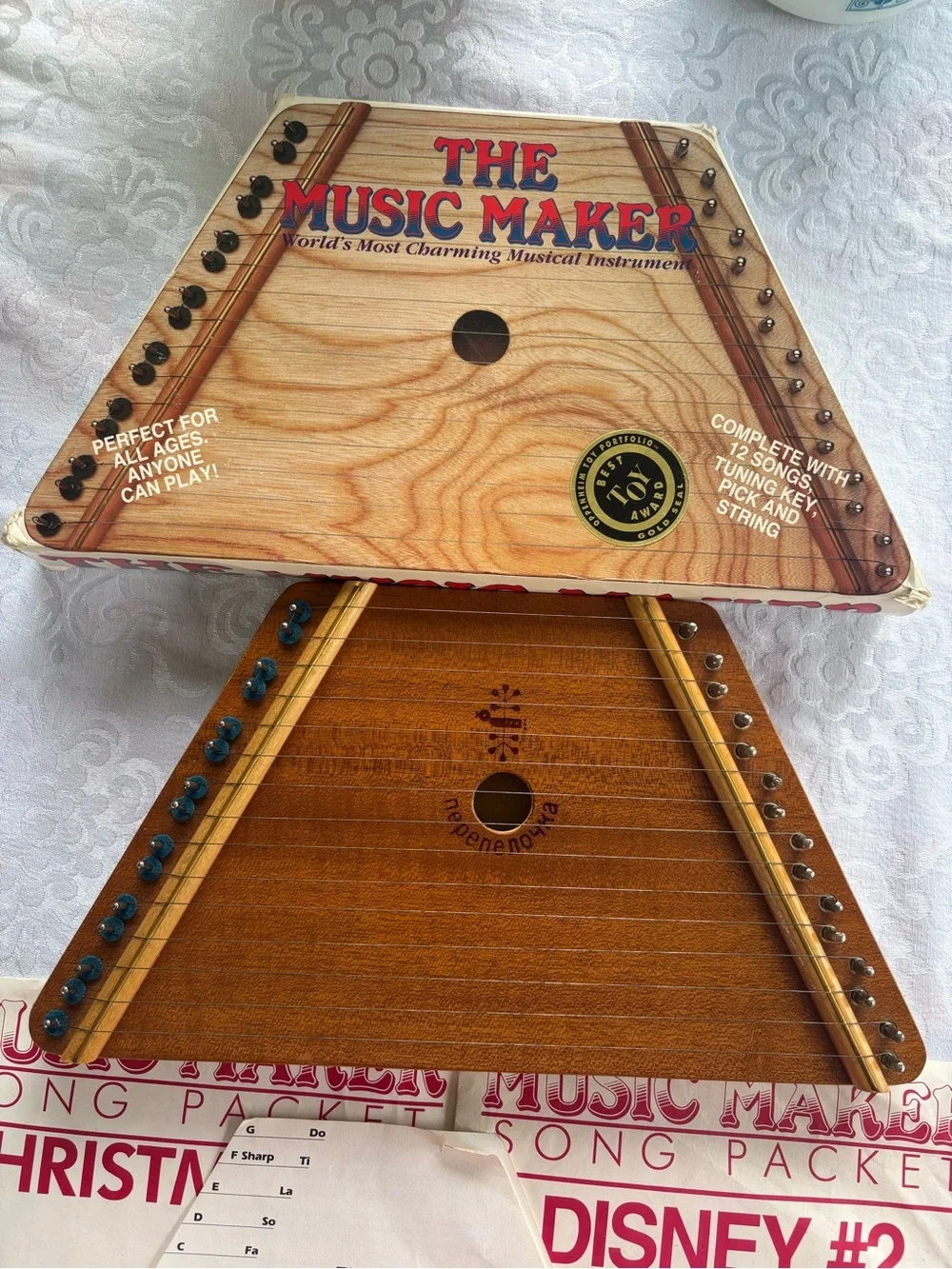 Source Unknown Natural Wood Triangle Music Maker with Red Artwork